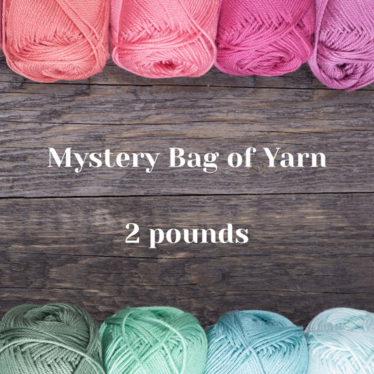 Mystery Bag of Yarn with premium gradient colorways in pink to purple and green to blue on rustic wood background